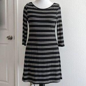 Flattering Black and White striped, V back dress from Lumiere Large